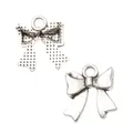 Vintage silver bow-knot metal pendants for DIY jewelry making with front and back view - Antique Silver