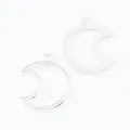 Close-up of two silver crescent moon alloy pendants with hollow frame design - Bright Silver