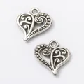 Pair of vintage silver heart charms with intricate filigree patterns for DIY jewelry making - Antique Silver
