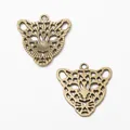 Two vintage bronze leopard head charms with intricate hollow-out zinc alloy design - Antique Bronze