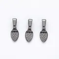 Detailed view of gunmetal alloy jewelry pendant connectors with textured dot finish - Gun Black