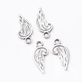 Set of four vintage silver zinc alloy wing pendants for DIY jewelry making and crafts - Antique Silver