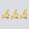 Detailed macro view of three vintage matte gold Pegasus charms for DIY jewelry making - Gold