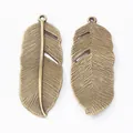 Vintage bronze alloy feather charms with detailed textures for DIY jewelry making - Antique Bronze