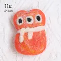 Cute orange felt monster brooch with three eyes and white stripe, size 5x6cm - Little Monster Style