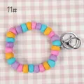 Pastel wool felt ball keychain bracelet with pink, yellow, blue and purple macaron tones - 10mm Felt Beads / Macaron Four Colors (11#)