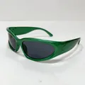 Detail of bright green aerodynamic sports sunglasses with dark grey oval lenses - Green Frame Grey Lens