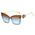 Modieuze cat-eye zonnebril met gradiënt glazen en hartvormige metalen pootjes - Thee Blauw Frame Thee Blauwe Lenzen