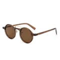 Vintage round tea brown sunglasses with metal bridge shown from a 45-degree angle - Sunglasses / Transparent Tea