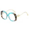 Fashionable oval sunglasses with blue leopard frames and golden heart metal accents - Optical Frame (C11) / Blue Frame Transparent Lens
