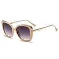 Chic beige cat-eye sunglasses with gold chain trim and gradient lenses at 45-degree angle - Cream Frame Purple Grey Gradient Lens