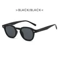 Modern vintage round frame sunglasses in classic black with stylish metal rivets - Black Frame Grey Lens