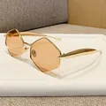 Fashionable hexagonal sunglasses with gold metal frame and light orange amber lenses - Champagne