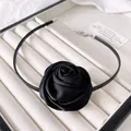 Close-up of a black satin rose choker necklace with silver adjustable metal chain - Black