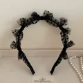 Detail of black mesh lace headband featuring polka dots and layered bow design - Black Polka Dot Mesh