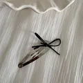Elegant silver waterdrop hair clip featuring a delicate black ribbon bow ornament - Silver Clip - Black Bow