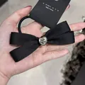 Elegante elastico per capelli in raso nero con fiocco e cristallo a forma di cuore - Nero Cuore Strass
