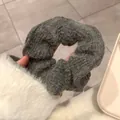 Detailed view of handmade chunky knit dark grey scrunchie with soft wool texture - Gray