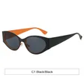 Lunettes de soleil œil-de-chat futuristes Y2K avec monture noire et intérieur orange - Extérieur Noir Intérieur Orange Lentille Grise