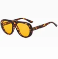 Detail view of tortoiseshell frame sunglasses with vibrant yellow lenses and retro style - C6 Demi Orange Lens