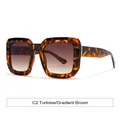 Lunettes de soleil carrées en écaille avec verres dégradés marron et détails dorés - Monture Écaille Brun Dégradé