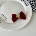 Detail of red velvet bow hair tie with handmade engraved heart and silver sparkles - Hair Clip / Burgundy