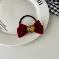 Detail of red velvet bow hair tie with handmade engraved gold heart buckle - Hair Tie / Burgundy