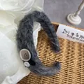 Macro shot of dark grey mohair headband featuring decorative vintage buttons - Black Heart Button
