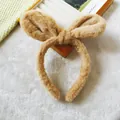 Close-up of soft plush bunny ear headband in brown for skincare and makeup - Khaki Bunny Ears