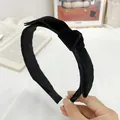 Detailed close-up of a black velvet twisted headband with a soft texture and subtle luster - Bowknot Twisted Headband / Black