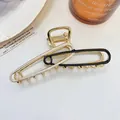 Grote gouden haarklem met elegant zwart en beige emaille paperclip ontwerp - Zwart