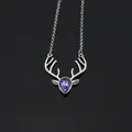Detailed view of silver deer antler necklace featuring a purple teardrop crystal - Silver + Purple