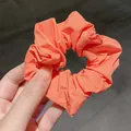 French retro oversized scrunchie in bright coral orange with soft textured fabric - Orange