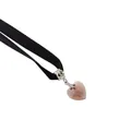 Close-up of pink heart crystal pendant on black velvet choker with silver metal settings - Purple