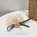 Elegant off-white lace scrunchie with pink camellia flower and green ribbons - Light Pink Camellia Style / Nude