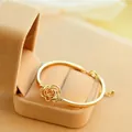 Elegant gold hollow rose bracelet for women displayed in a premium velvet jewelry gift box - Hollow Rose Gold Style