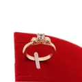 Top view of gold skull ring with a round zircon stone on a red velvet jewelry display - US 5 / Rose Gold