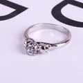 Silver skull ring with crystal zircon and punk gothic relief detailing on white background - US 5 / Silver