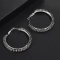 Silver hoop earrings featuring three rows of black rhinestones in a large circular design - Black