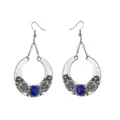 Detailed view of bohemian antique silver drop earrings with blue gemstones and heart pattern - Blue
