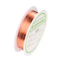 Detalle de hilo de cobre dorado de 0,8mm en carrete para creación de joyas DIY - 0,3 mm / Cobre