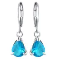 Close-up of blue pear-cut crystal drop earrings with silver lever-back clasps - Aqua