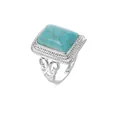 Macro detail of rectangle turquoise gemstone ring with silver bohemian filigree engraving - US 6 / Blue