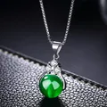 Silver plated short necklace featuring a round green cat eye stone and zircon pendant - Green Chalcedony