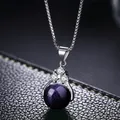 Silver box chain necklace featuring a blue sandstone sphere pendant with sparkling crystals - Blue Sandstone