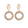Bohemian woven straw hoop earrings with golden seashell studs on a white background - Gold And Beige