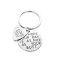 Detailed close-up of engraved heart and round stainless steel pendants on a keyring - Large / Silver