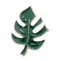 Enamel monstera leaf brooch in deep green with gold plating on a clean white background - Monstera Leaf