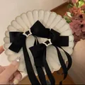 Rosa Satin-Schleife Haarspangen mit Silberstern-Strasssteinen und langen eleganten Bändern - Schwarz Stern Strass