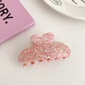 Detail showing marble texture acetic acid hair claw clip in pink and cream finish - Cherry Blossom Pink (Heart Butterfly Shape)